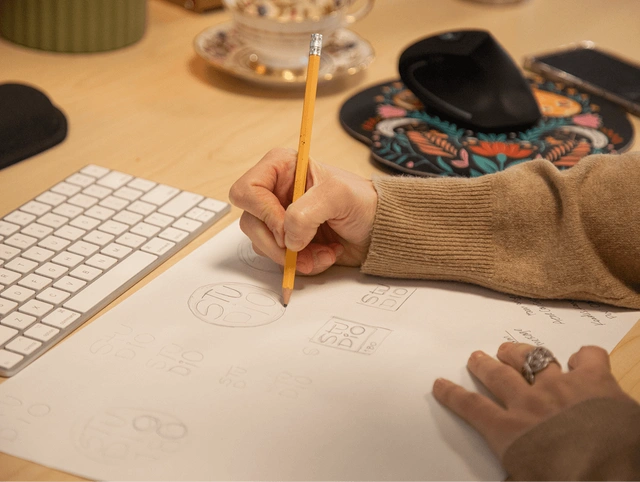 Designer sketching a studio logo